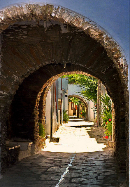 Paved alley and arches in Steni, Tinos island, Greece